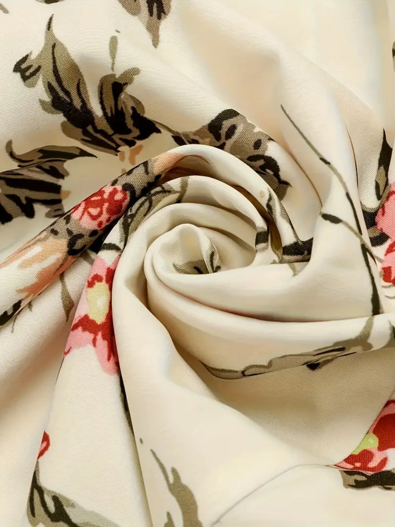 Close-up of soft fabric showcasing the floral print of a 2025 floral print women's dress