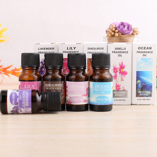 Aromatherapy essential oil humidifier fragrance oils including lavender lily sandalwood vanilla and ocean in small brown bottles