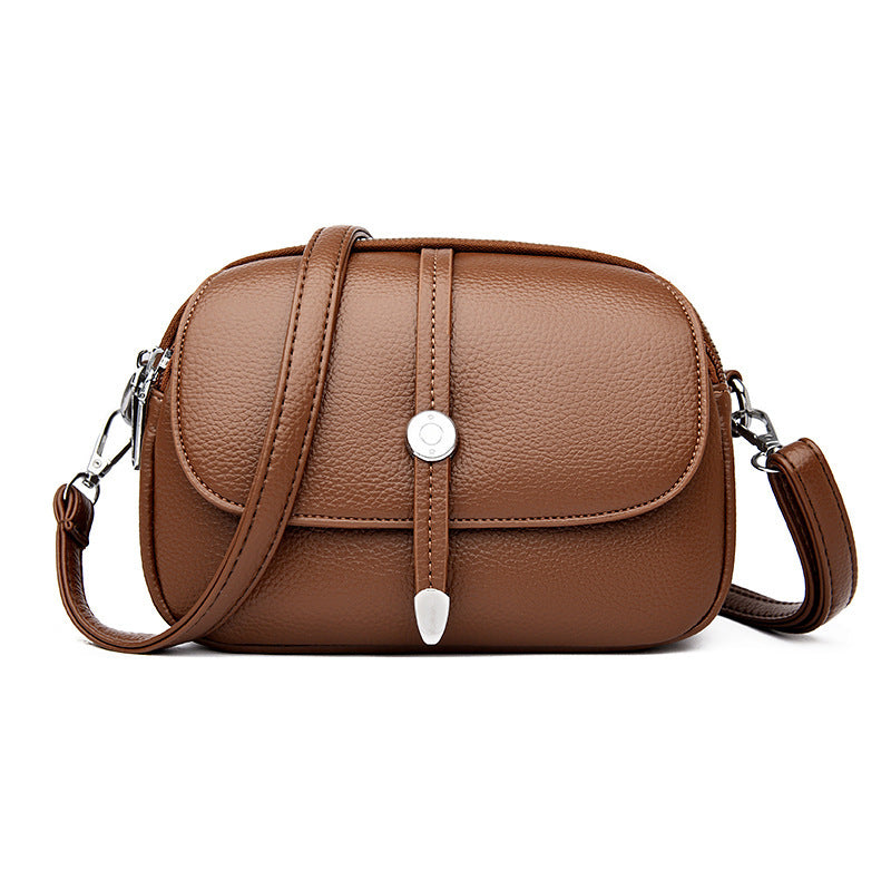 Brown leather city crossbody bag for women with adjustable strap and silver-tone hardware