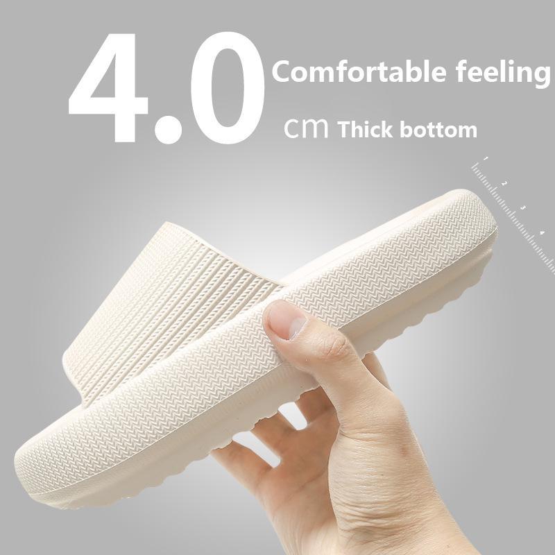 Hand holding a white comfortable indoor house slides with 4 cm thick bottom from Hangzhou Jingqian