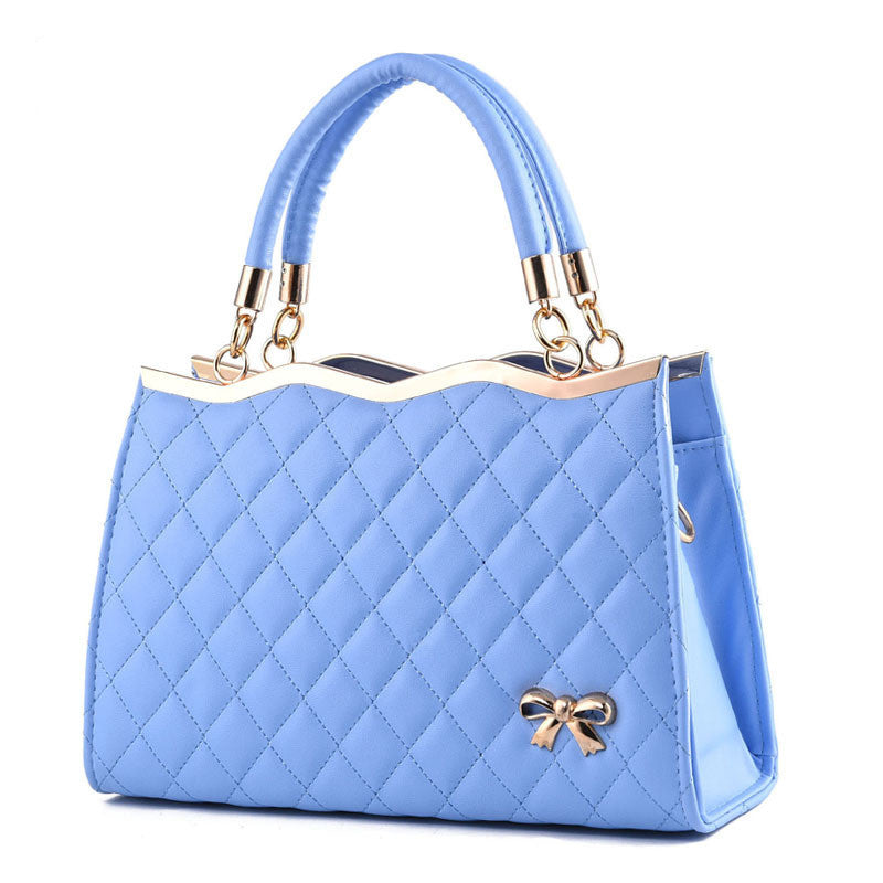 Yiwu Renfan blue crossbody bag with bow featuring quilted design and gold-tone accents