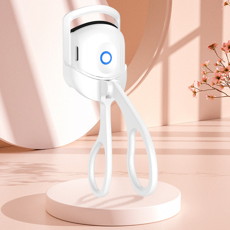Popmarket electric heated eyelash curler in white with ergonomic handle and blue power indicator light