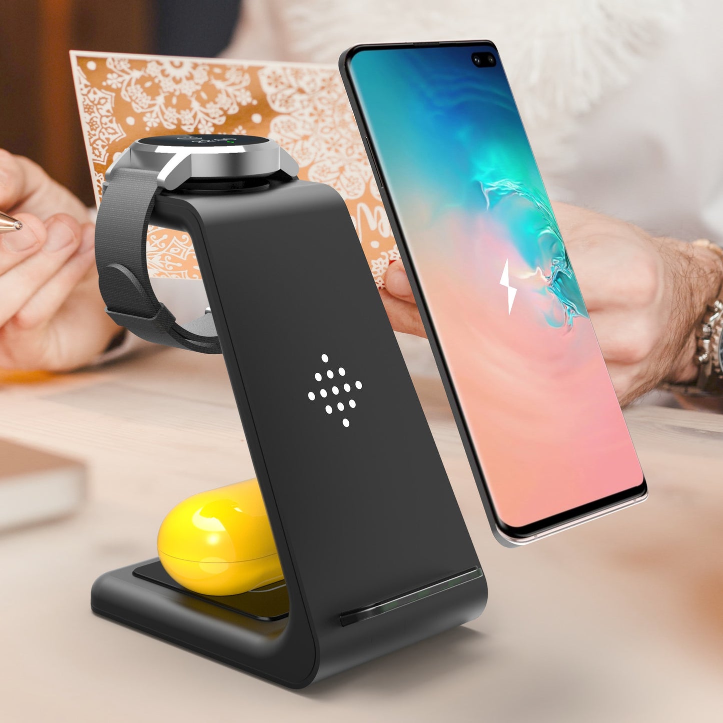 3 in 1 wireless charging station by Hangzhou Jingqian charging phone, smartwatch, and earbuds