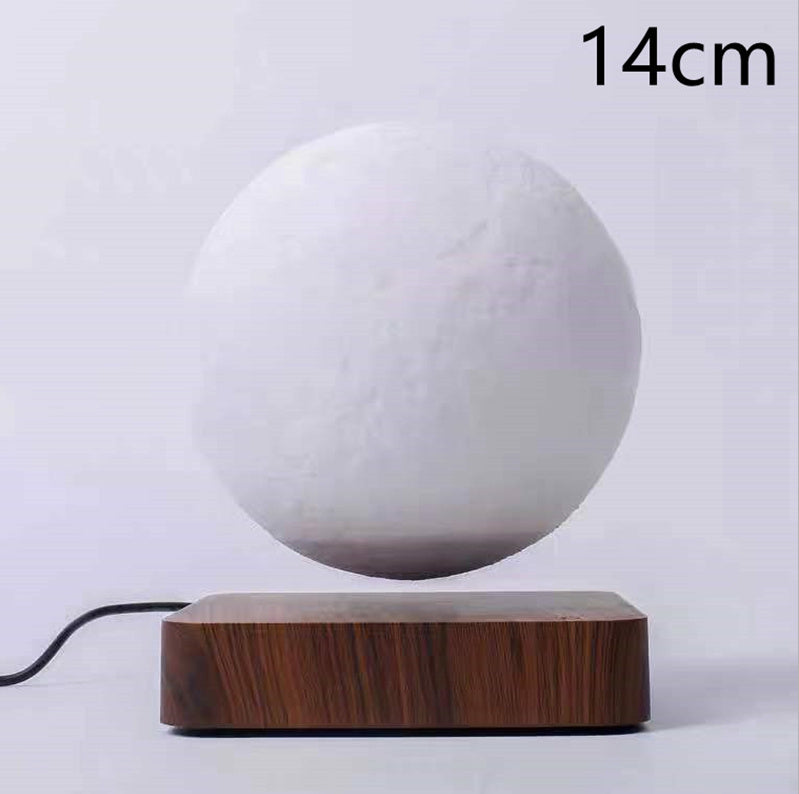 Box of Pandora magnetic levitation moon lamp floating above wooden base with power cord