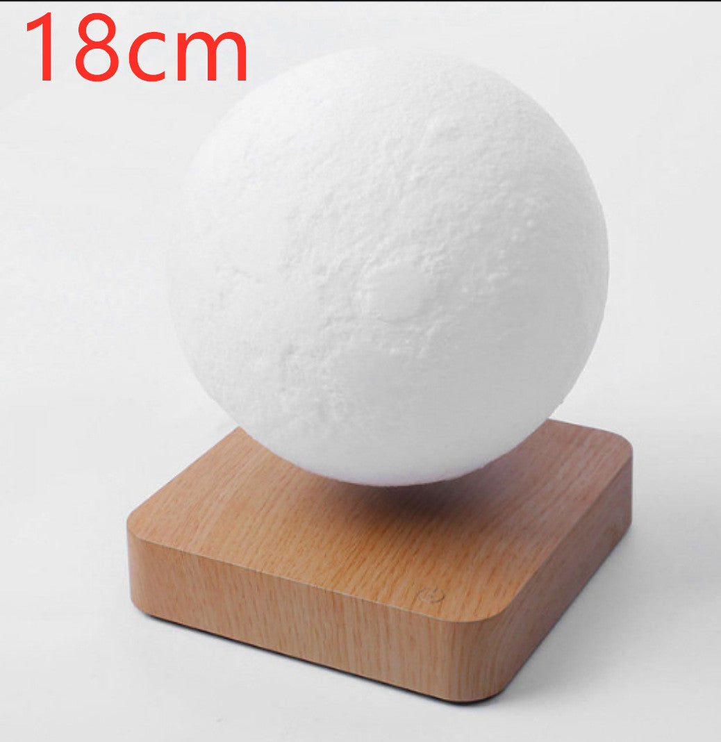 18cm magnetic levitation moon lamp floating above wooden base by Box of Pandora