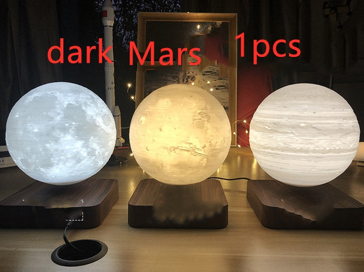 Box of Pandora magnetic levitation moon lamp showing glowing moon and planets on wooden bases