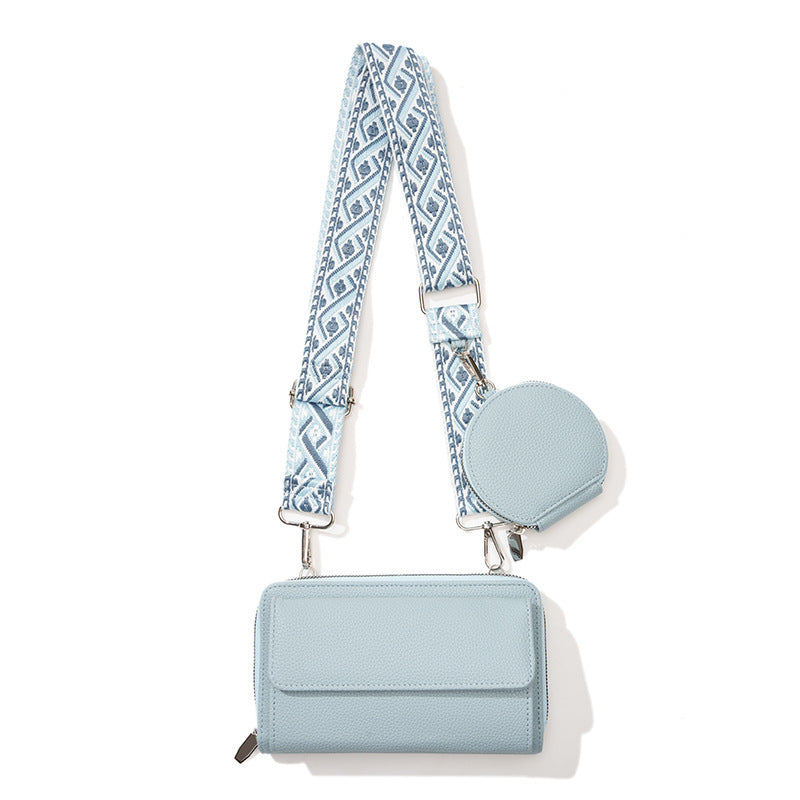 Stylish phone bag for women in light blue with detachable patterned strap and round coin pouch