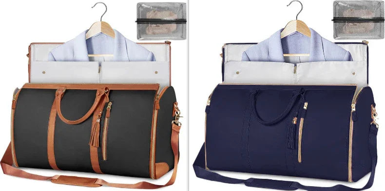 Two foldable garment bags with brown and navy leather handles, each holding a suit and a mesh toiletry pouch