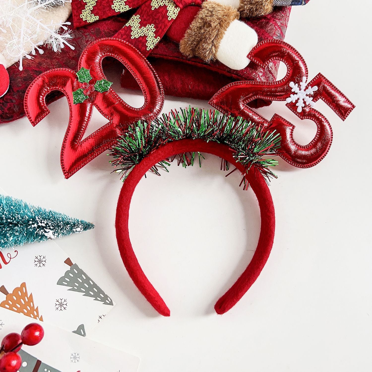 Red 2025 Christmas headband for women with festive decorations and holiday-themed design