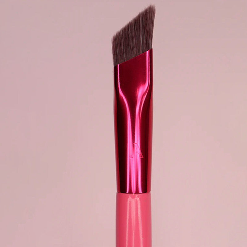 3D eyebrow brush for women with angled soft bristles and pink metallic handle for precise eyebrow painting