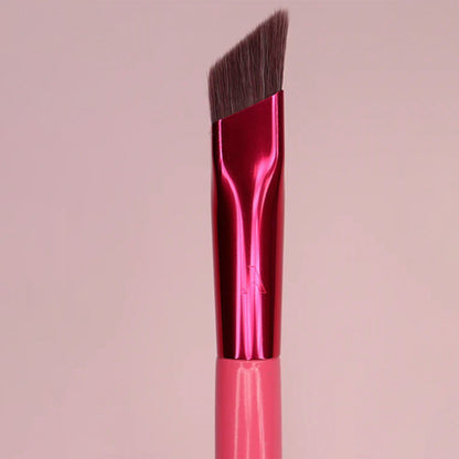 3D eyebrow brush for women with angled soft bristles and pink metallic handle for precise eyebrow painting