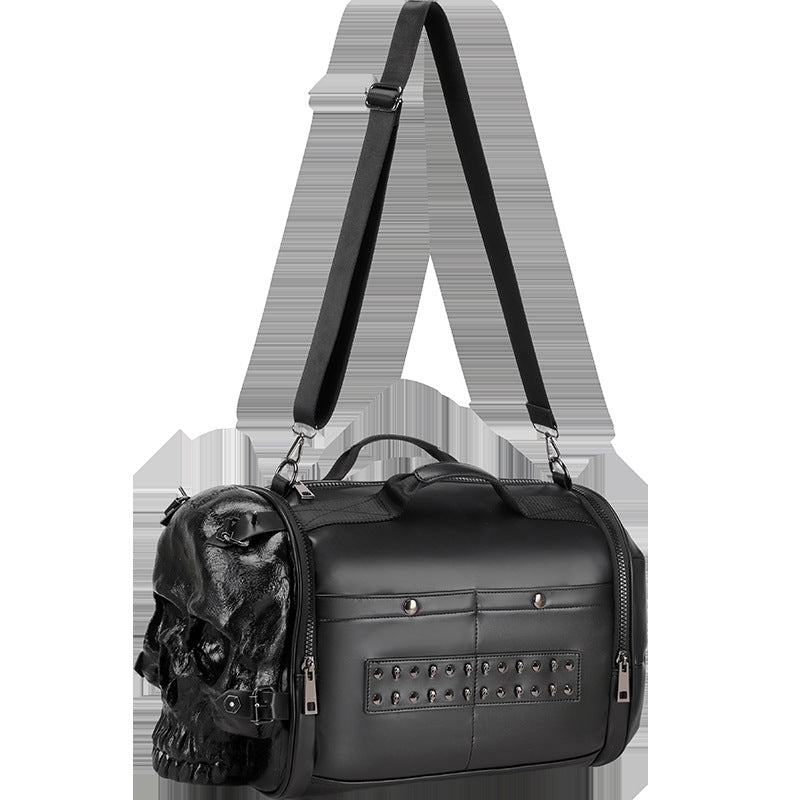 3D skull crossbody bag in black leather with studded detailing and adjustable strap