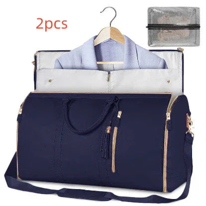 Navy blue travel duffel bag with multiple compartments and a hanging garment bag inside