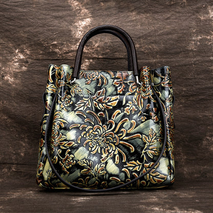 Handbag with intricate floral patterns on a wooden surface