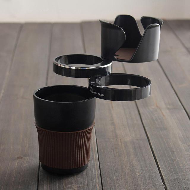 Adjustable car drink holder cup bottle can holder door mount stand in black over wooden surface