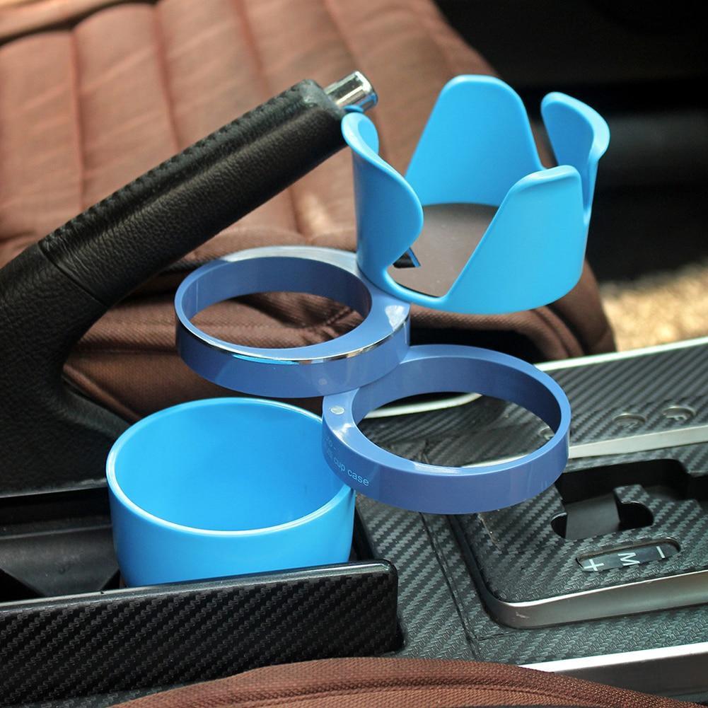Adjustable car drink holder in blue installed in car center console cup holder area