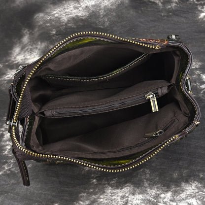 Open American designer leather handbag shoulder bag for women showing interior compartments and zipper pockets