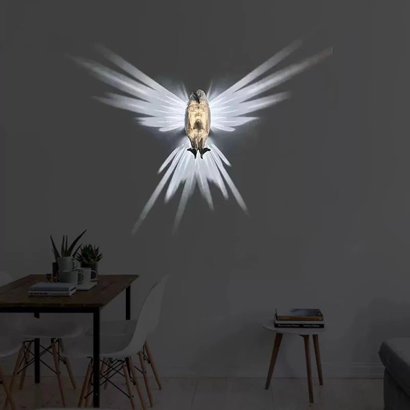 Hangzhou Jingqian modern bird wall lamp owl eagle shape projecting dramatic wing shadows on living room wall
