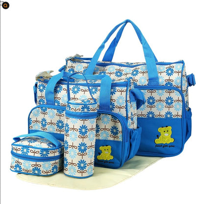 Box of Pandora baby diaper bag set in blue with multiple bags and teddy bear design for parents