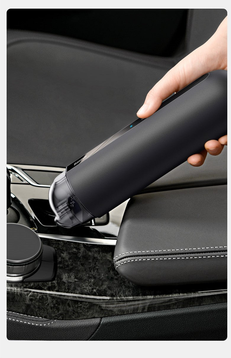 Box of Pandora wireless car vacuum cleaner in use to clean black car interior with easy grip design