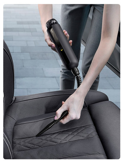Wireless car vacuum cleaner being used to clean car seat crevices with a slim nozzle attachment