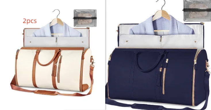 Two travel garment bags in beige and navy blue, each holding a hanging coat, shown with carry straps and compartments