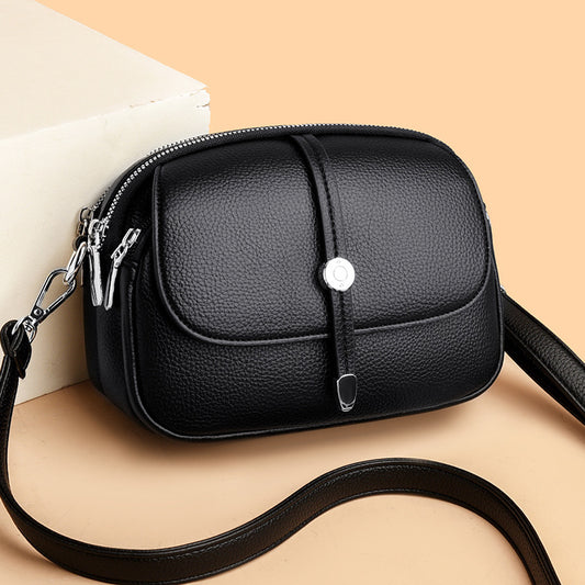 Black leather city crossbody bag for women with silver zipper and adjustable strap
