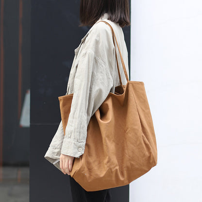 Women’s large canvas tote bag in brown, perfect for daily use and shopping