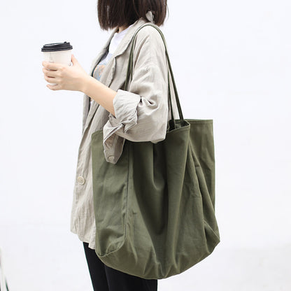 Women's large canvas tote bag in olive green, perfect for everyday use and stylish outings