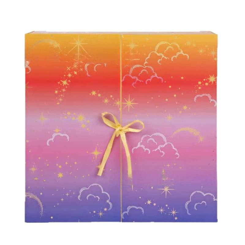 Colorful Christmas crochet countdown box with cloud and star designs and a yellow ribbon tie