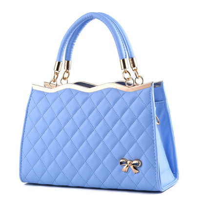 Yiwu Renfan blue crossbody bag with bow featuring quilted design and gold-tone accents