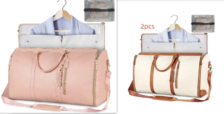 Two large travel garment bags in pink and white with brown straps, shown open with clothes inside