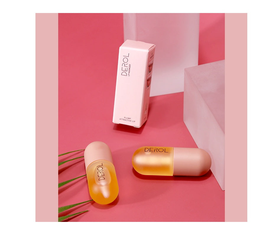 Yiwu Renfan instant lip plumper oil in capsule-shaped containers with pink and orange design on pink background