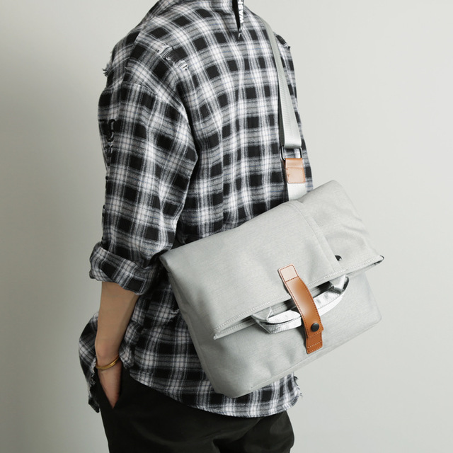 Stylish gray durable messenger bags for men, perfect for everyday use and commuting