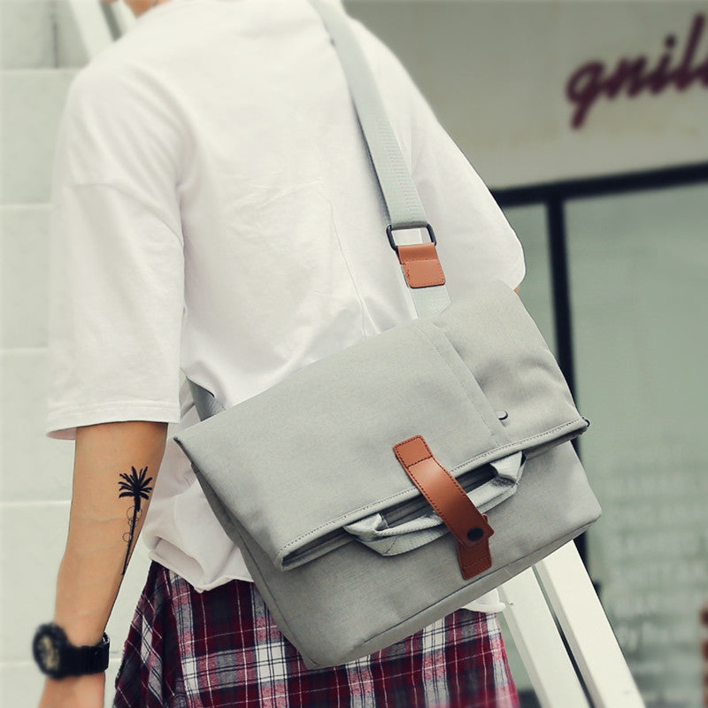 Stylish durable messenger bags for men with adjustable strap and front flap in gray