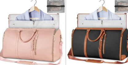 Two stylish travel garment bags in pink and black with brown accents, each holding a hanging blazer