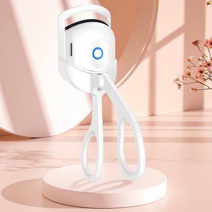 Popmarket electric heated eyelash curler in white with ergonomic handle and blue power indicator light