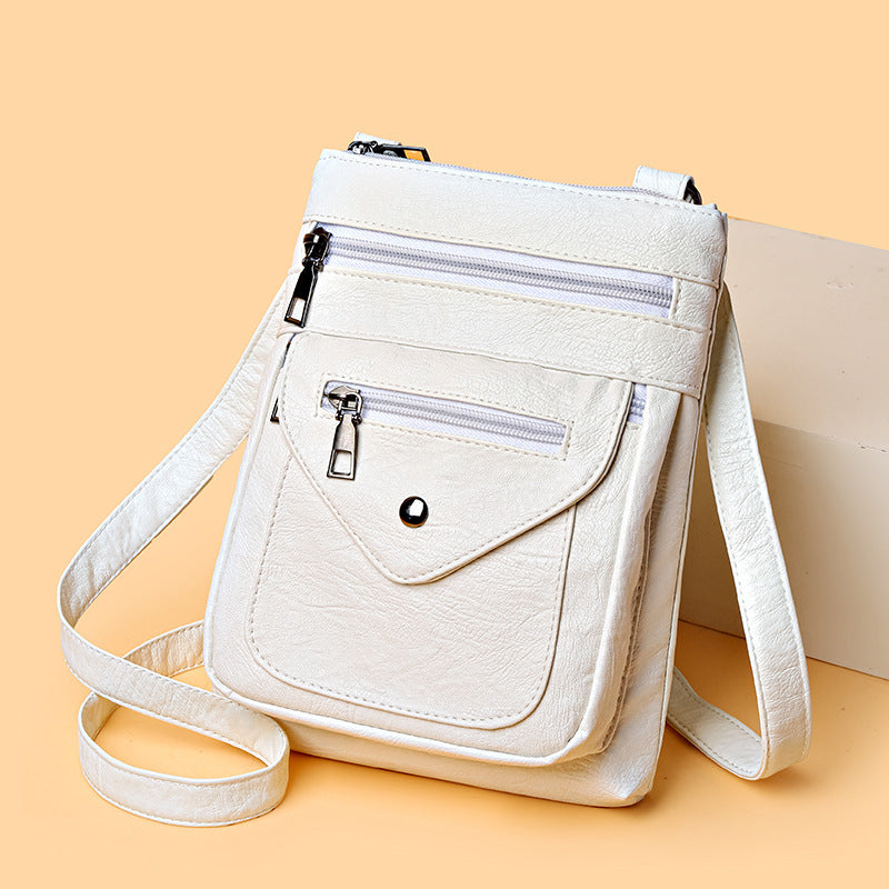 Yiwu Renfan women's shoulder bag in white with multiple zip pockets lightweight crossbody bag for women