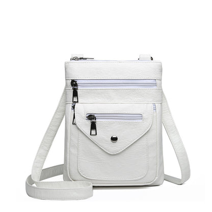 White lightweight crossbody bag for women with multiple zippered pockets and adjustable strap