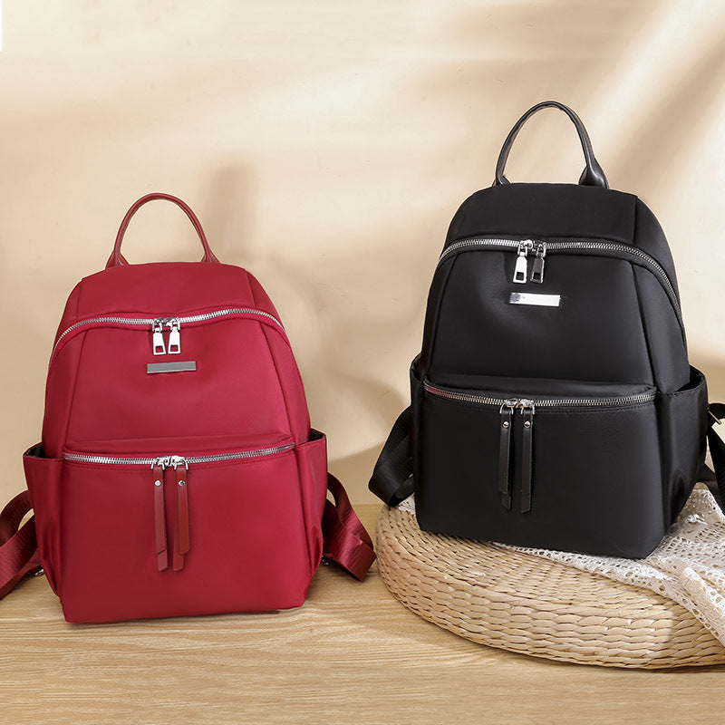 Korean style oxford backpack for women in red and black with multiple pockets and stylish design