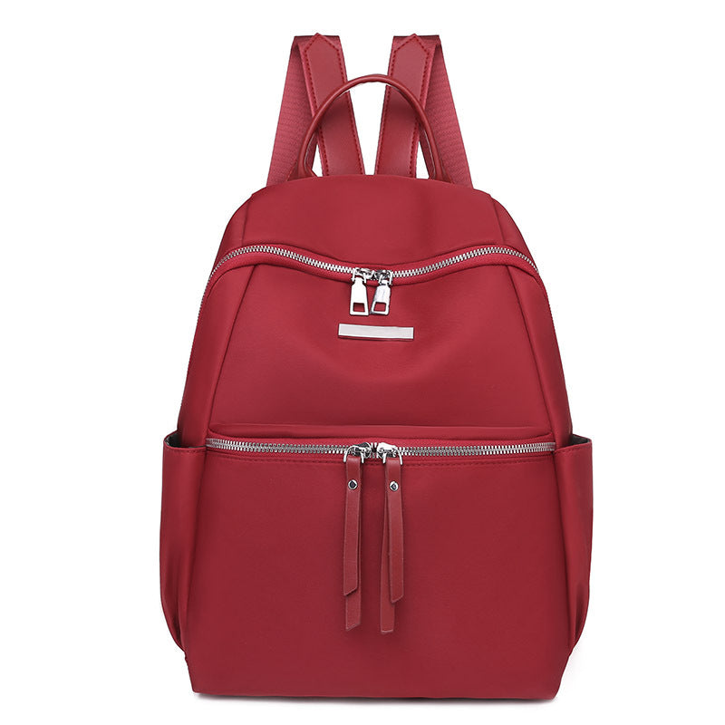 Stylish red Korean style oxford backpack for women with multiple pockets and zippers