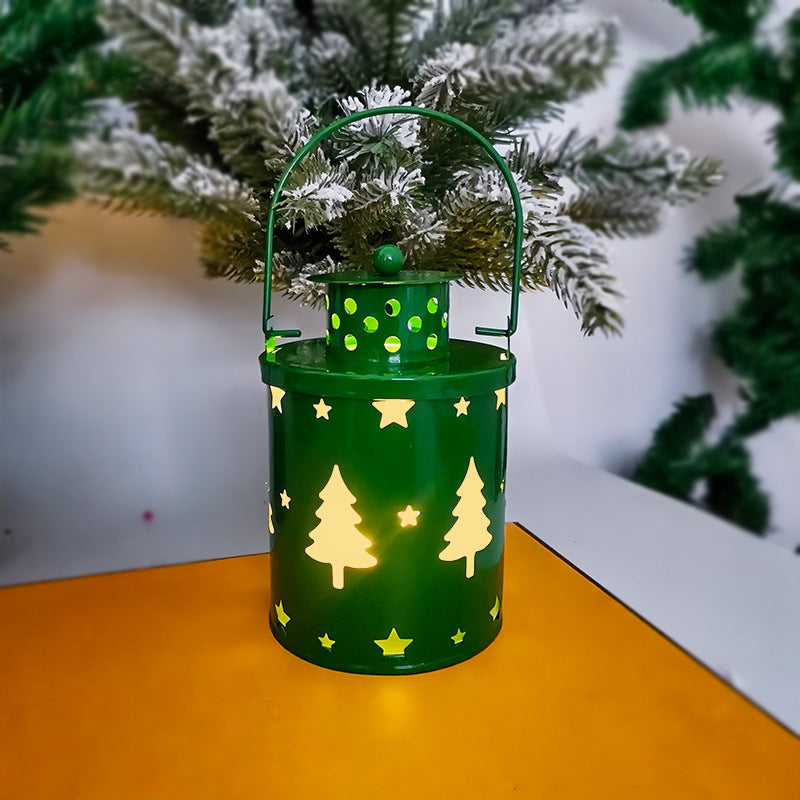 Green LED Christmas candle lanterns with tree and star cutouts for festive decor