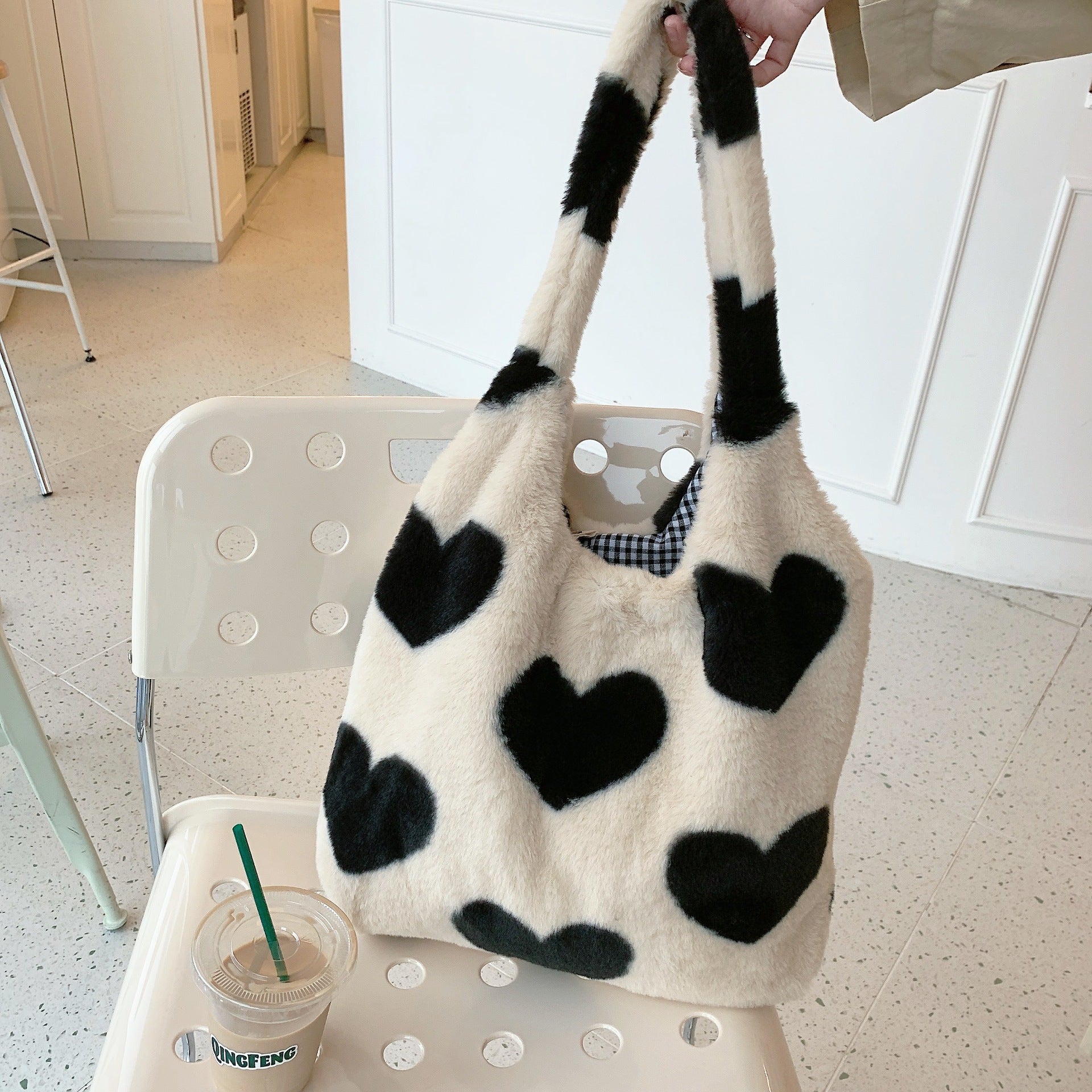 Love heart double-sided shoulder bag with black and white heart patterns for stylish everyday use