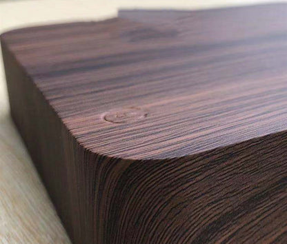 Close-up of dark wood base for magnetic levitation moon lamp with smooth rounded edges