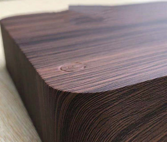 Close-up of dark wood base for magnetic levitation moon lamp with smooth rounded edges