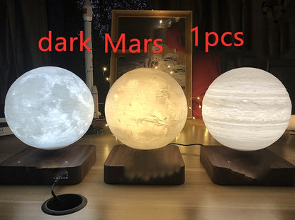 Box of Pandora magnetic levitation moon lamp showing glowing moon and planets on wooden bases