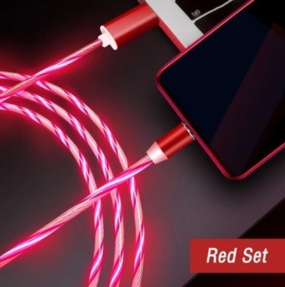 Red magnetic streamer charging cable connected to smartphone and laptop for fast data transfer