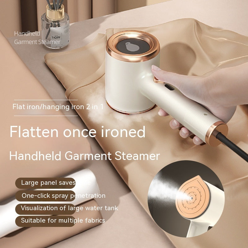 Mini handheld garment steamer in white and gold being used on beige fabric with large water tank visible