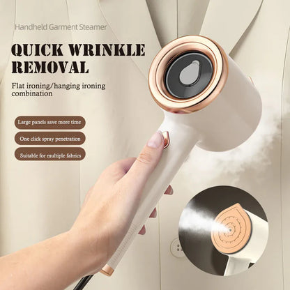 Mini handheld garment steamer in white and rose gold held by hand for quick wrinkle removal