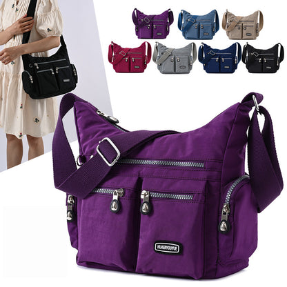 Purple multi pocket crossbody bag for women with adjustable strap and multiple zipper compartments